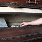Placing stones on coffin of ASM